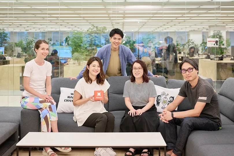 People posing on a sofa