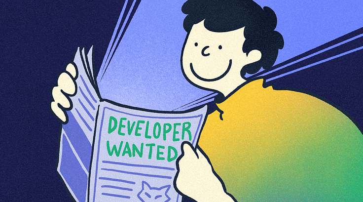 「Developer Wanted」と書かれたパンフレットを見て微笑む人物