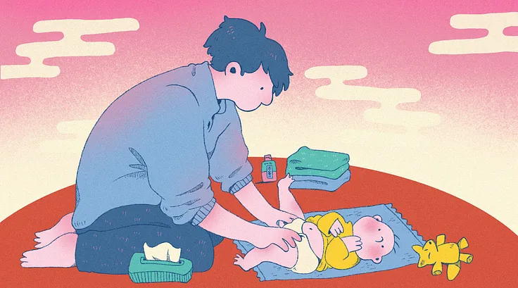 A father changing a newborn.