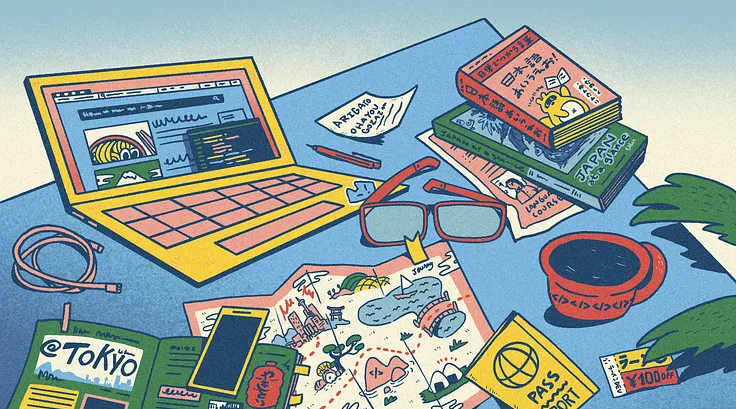 A laptop, map, and books about Japan.